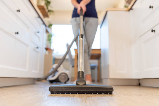 Lady sweeping floor | Bassett Carpets